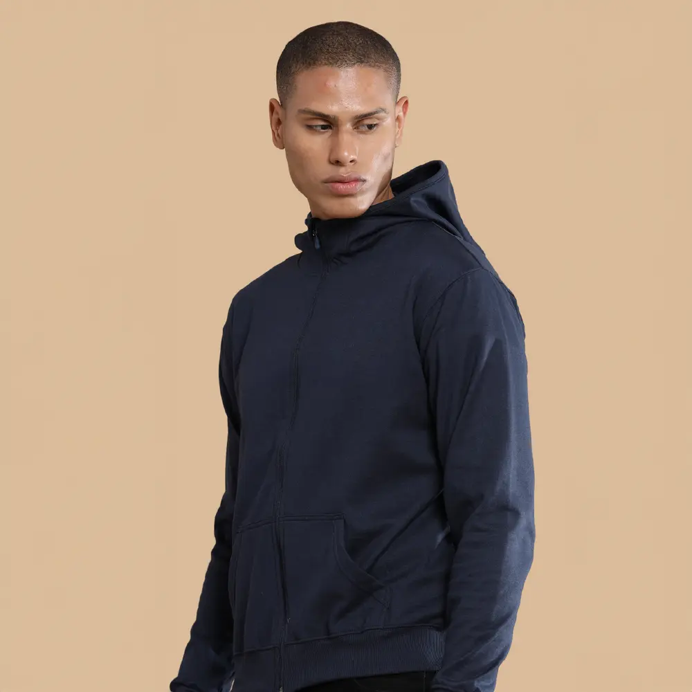 A man wearing a black hoodie with white drawstrings