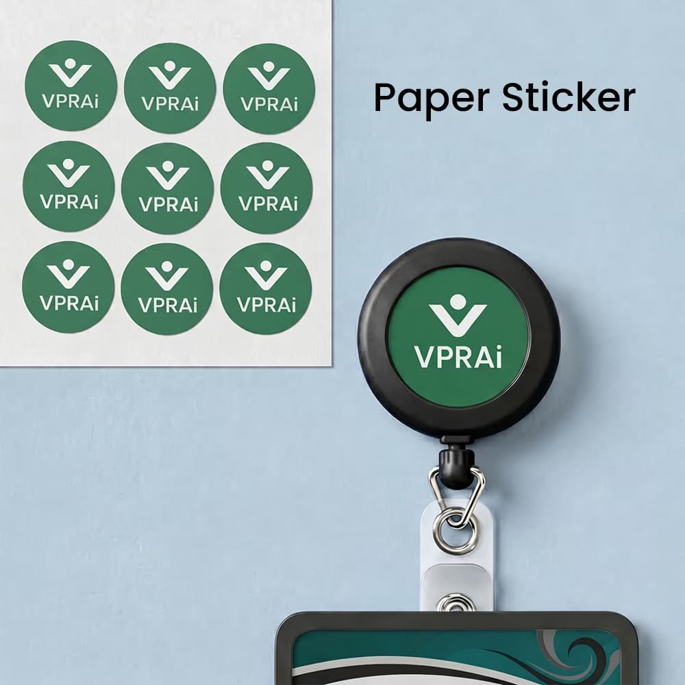 Infographic showing a sheet of green corporate "VPRAi" paper stickers next to a black retractable ID badge reel with a sticker applied.