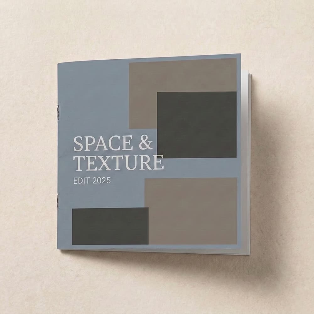 Staple-bound 8x8 booklet cover titled "SPACE & TEXTURE EDIT 2025" with an abstract block design on a light textured background.